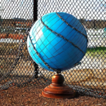 Globe with a chain link fence across it
