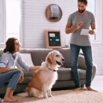 Couple and their dog in an automated pet-friendly smart home